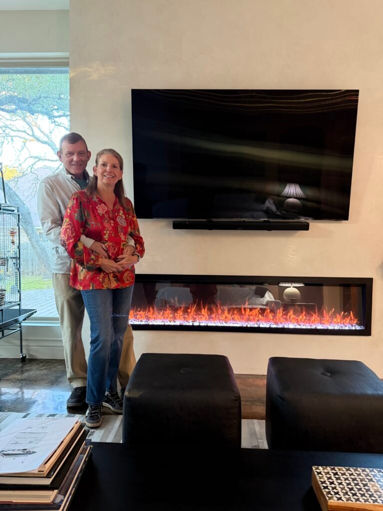 Photo of client standing in their custom home built by 919 Custom Homes